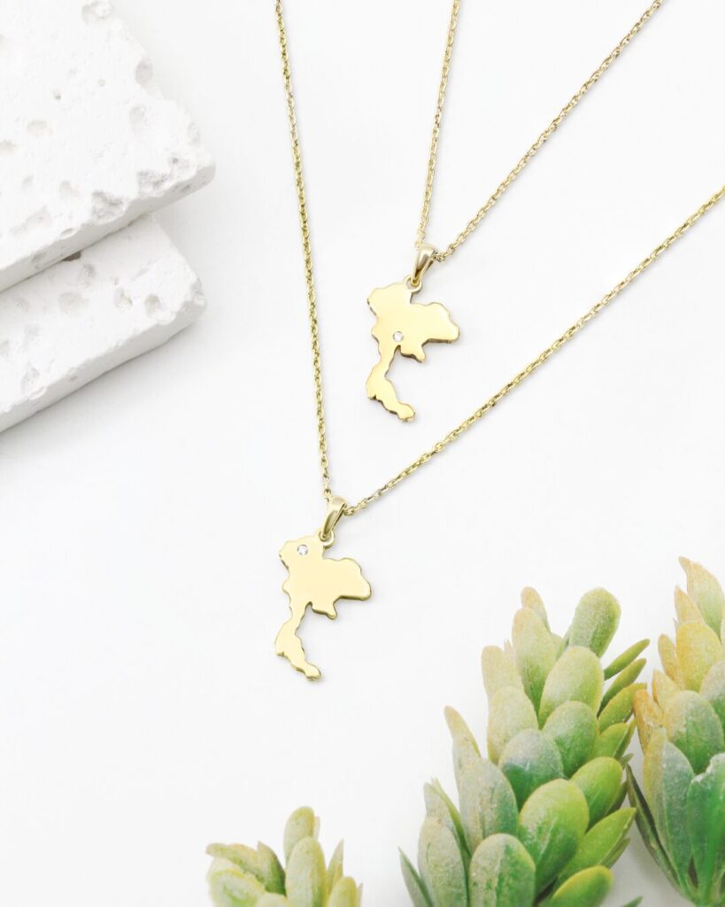 Thai map necklace in silver with a set stone, made in Bangkok